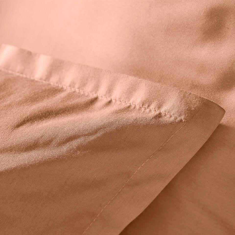 zoom matière percale de coton rose pêche