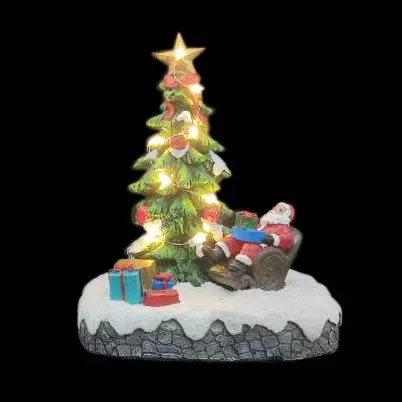Escena de vida iluminada El árbol de Santa Claus a pilas