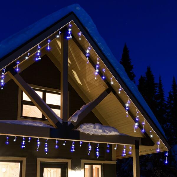 Lichtprojektor für außen für tanzende Schneeflocken an der Hausfassade