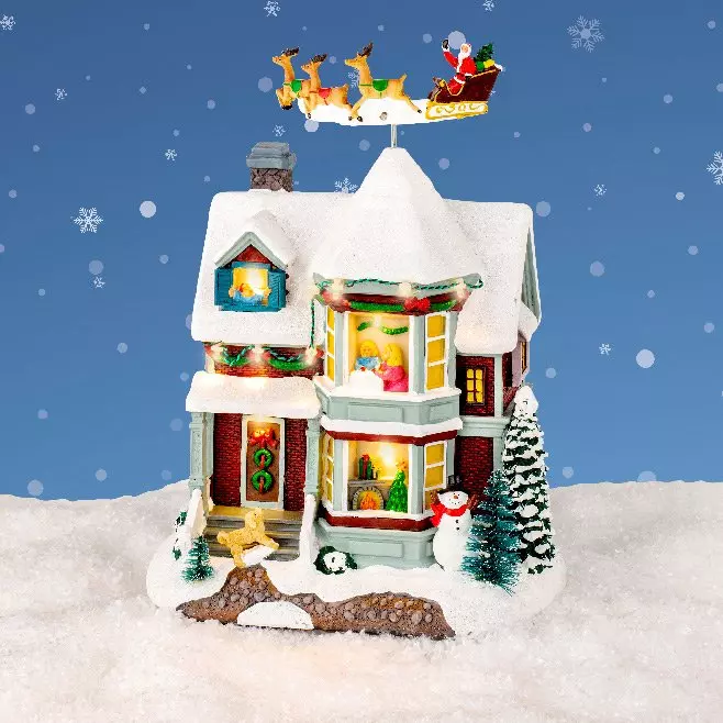 Casa de pueblo iluminada Noche de Navidad a pilas 1
