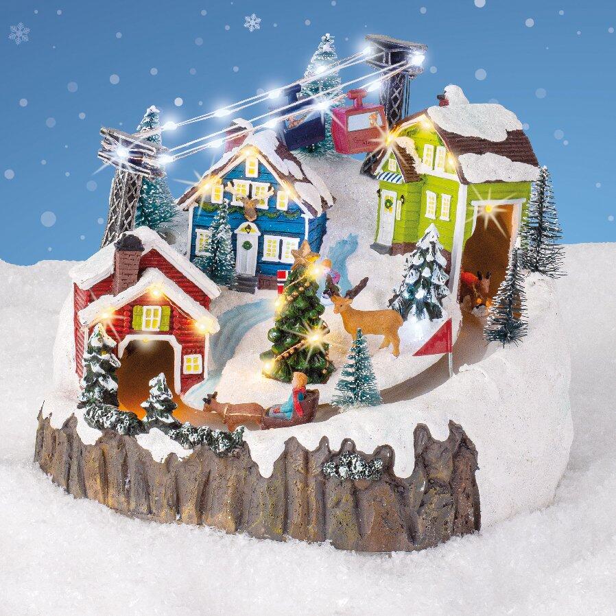 Villaggio di Natale luminoso e musicale vacanze alla neve 1