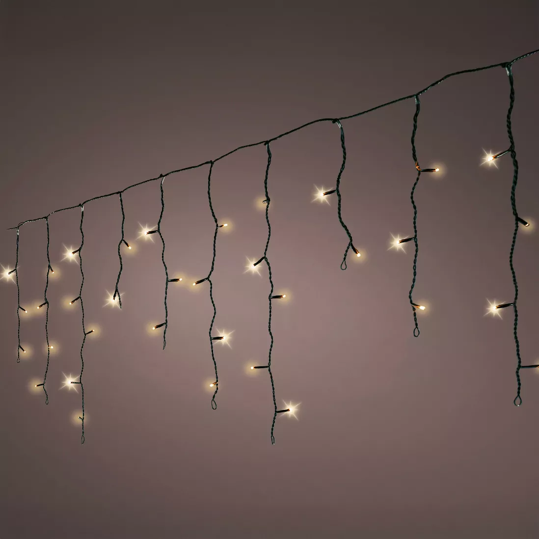 Stalactite lumineuse 20 m 490 LED câble noir Stars Blanc chaud doré