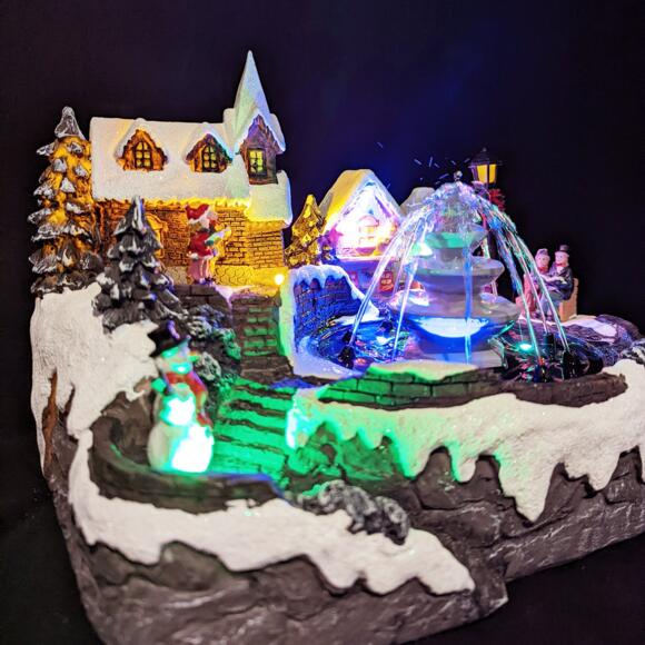 Villaggio di Natale luminoso e musicale Fontana illuminata 3