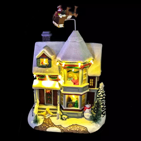 Casa de pueblo iluminada Noche de Navidad a pilas 2