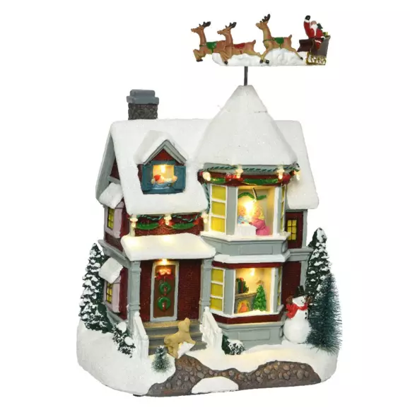 Casa de pueblo iluminada Noche de Navidad a pilas 3