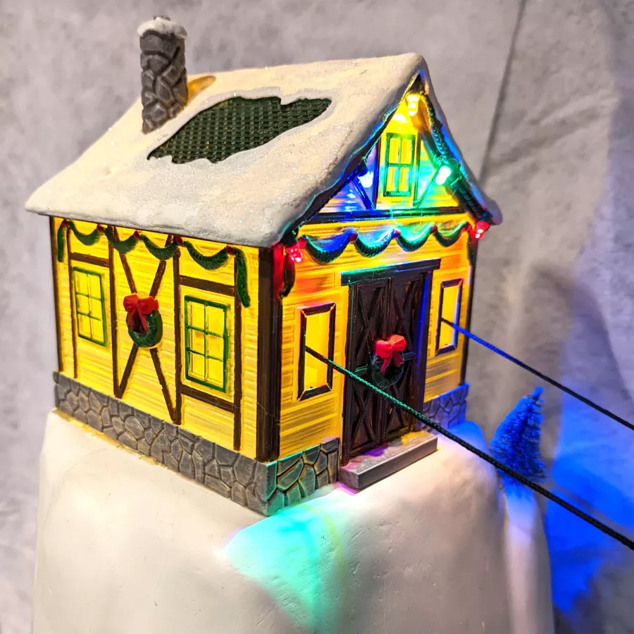 Pueblo de Navidad luminoso y musical Teleférico
