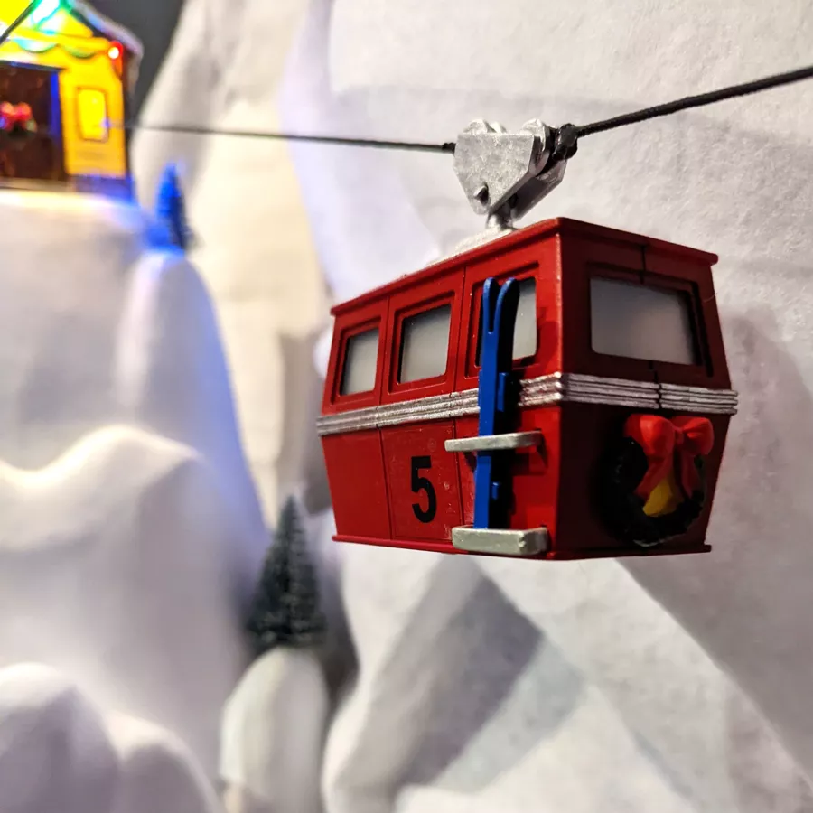 Pueblo de Navidad luminoso y musical Teleférico