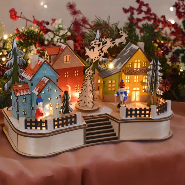 Beleuchtete Weihnachtsdorf-Szene mit Weihnachtsmann