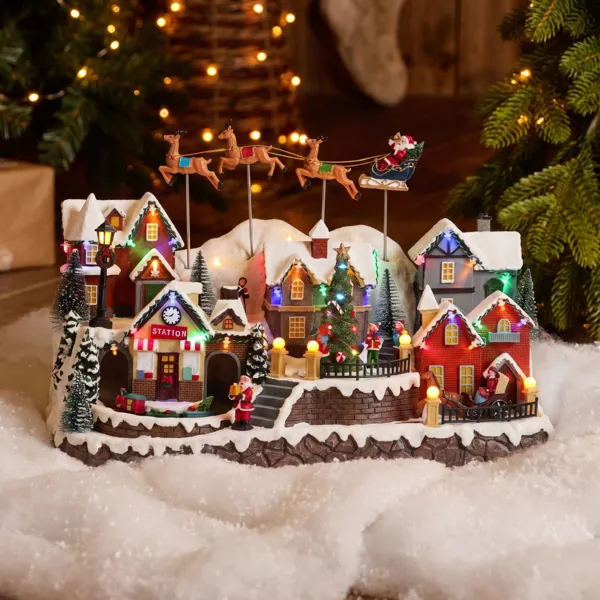Villaggio di Natale luminoso e animato (H31 cm) Le Renne volanti di Babbo Natale