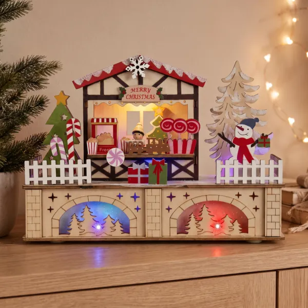 Villaggio di Natale in legno luminoso a pile/USB (25 x H18 cm) Dolci colorati